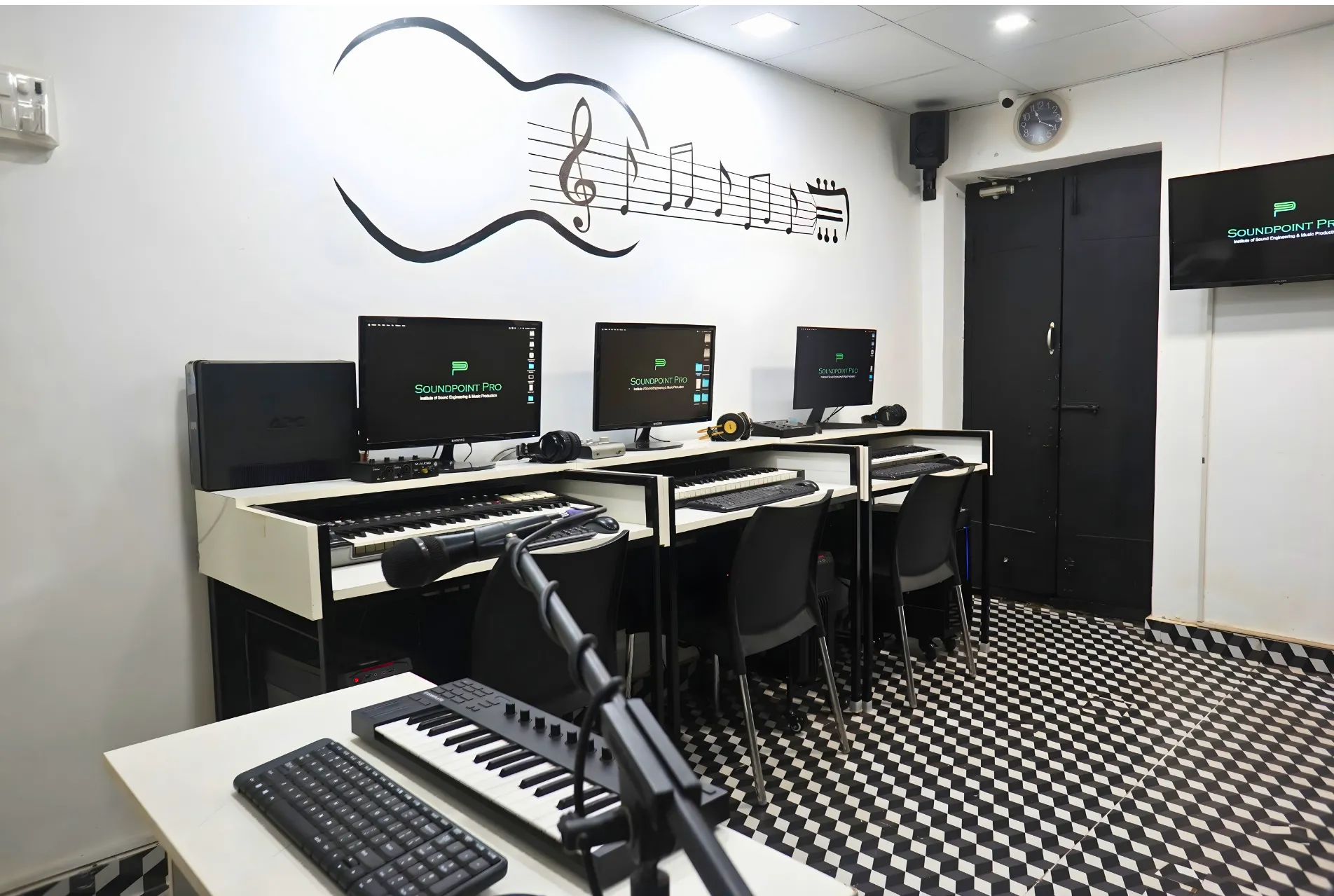 Music programming lab with MIDI keyboards and headphones
